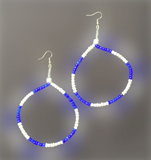 Beautiful wire blue and white earrings. Change the shape of the earrings by adjusting the wire. Blue Hoop Earrings With Ear Wire, Adjustable White Wire Wrapped Hoop Earrings, White Wire Wrapped Dangle Hoop Earrings, White Teardrop Wire Wrapped Earrings, Blue Wire Wrapped Hoop Earrings, Blue Wire Wrapped Round Hoop Earrings, Adjustable White Hoop Earrings With Ear Wire, White Beaded Wire Wrapped Drop Earrings, White Wire Wrapped Beaded Drop Earrings