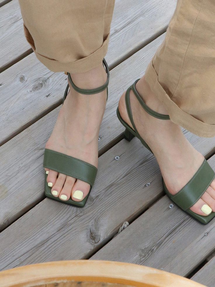 Editor's NotesAMELLIE's chic designed heeled sandals can be matched well with daily casual outfits. - Basic and feminine mood- Chic square toe- Easy to wear clip strap- Subdued deep green color- Slim ankle strap- Luxurious gold hardware- Daily point itemMeasurements(in.)KR 225MM ~ 250MM / US 5.5 ~ 8- Heel height : 2.36 in.*Fits true to the size.Composition & Care- Upper : Lamb skin / Lining : Synthetic leather- Natural leather may have fine scratches and wrinkles- Avoid direct sunlight Green Square Toe Evening Sandals, Modern Block Heels With Wrapped Heel For Summer, Modern Green Heels For Summer, Green Heels With Sculpted Heel And Single Toe Strap, Spring Open Toe Kitten Heels With Wooden Heel, Summer Low Heel Kitten Heels With Wooden Heel, Summer Kitten Heels With Low Wooden Heel, Summer Kitten Heels With Wooden Low Heel, Chic Green Sandals With Sculpted Heel