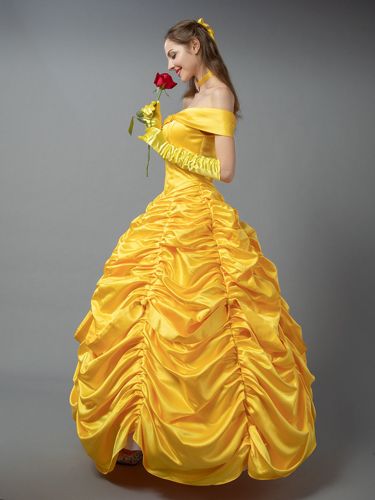 a woman in a yellow dress holding a rose