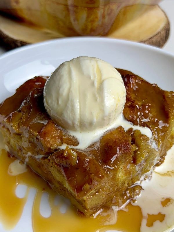 a piece of bread pudding with ice cream on top