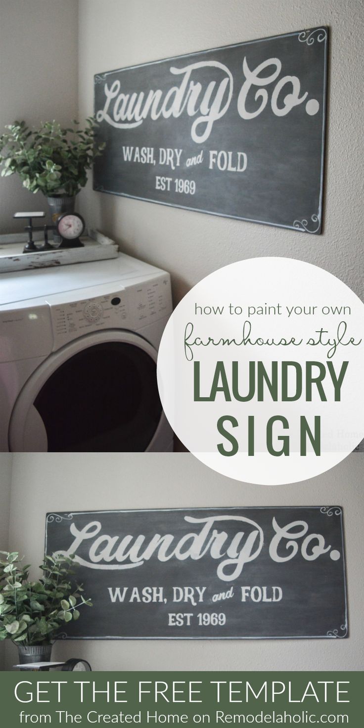 the laundry sign is hanging on the wall next to a washer and dryer