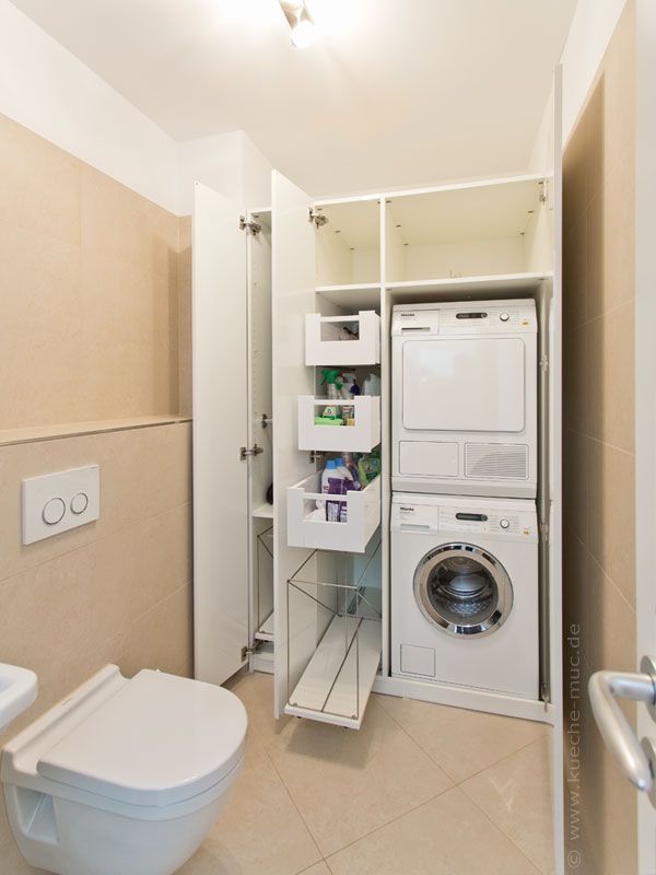 a washer and dryer in a small bathroom