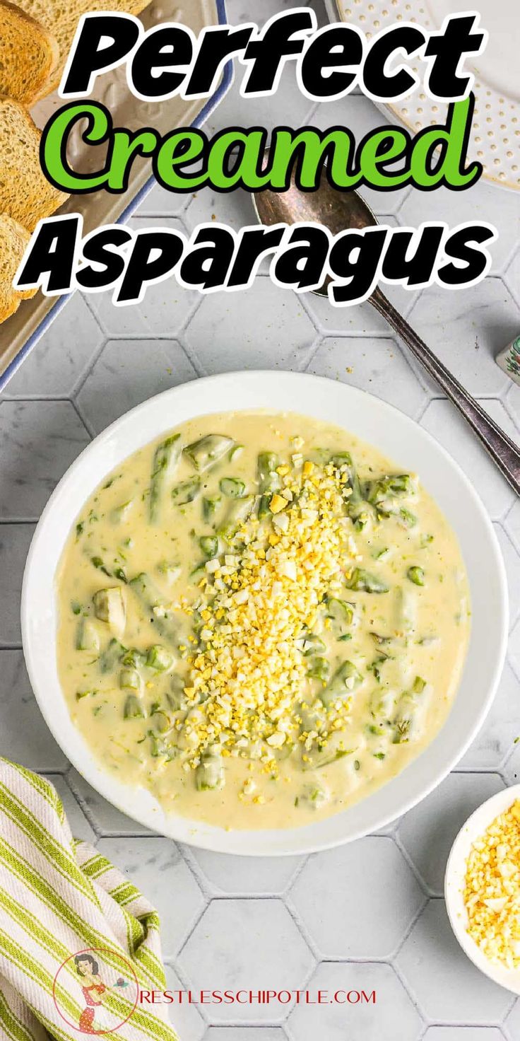 a bowl of creamed asparagus soup with bread in the background and text overlay