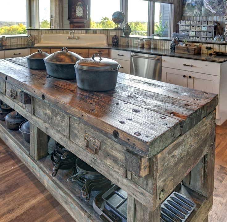 a kitchen island made out of wooden planks