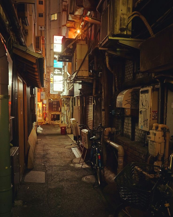 an alley way with bikes parked in it