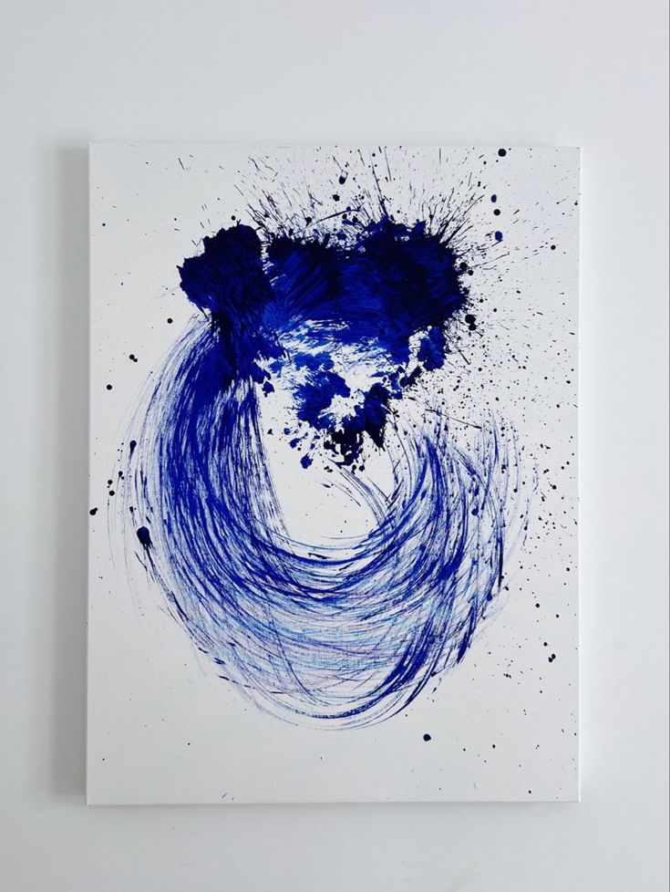 an abstract painting with blue paint splattered on it