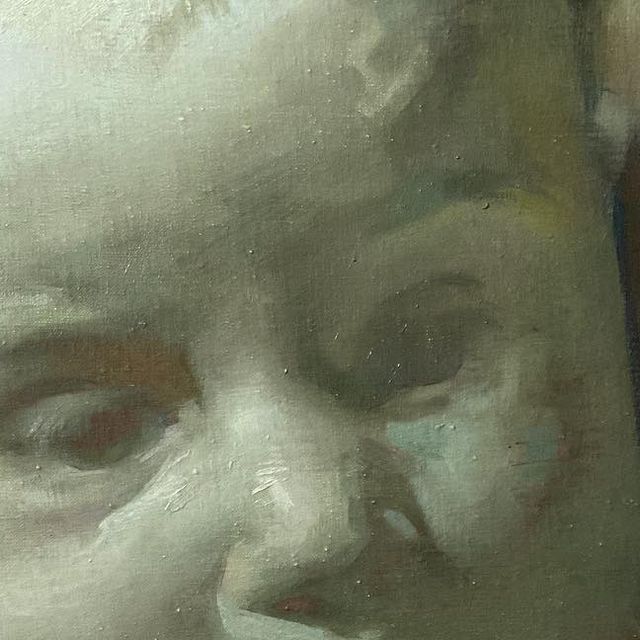 a close up of a painting of a child's face