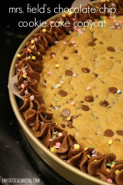 a cookie cake with chocolate chips and sprinkles on the top is in a pan