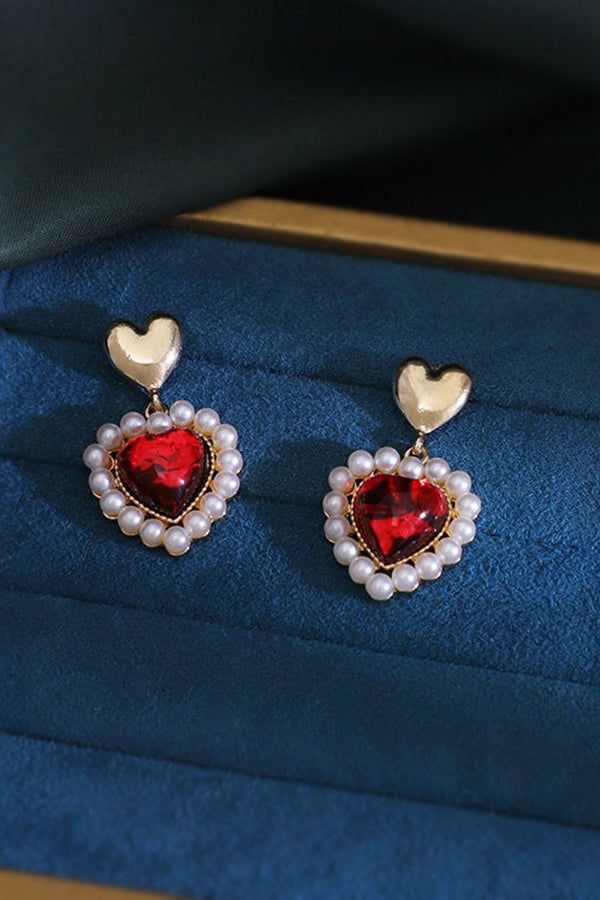 Accessorize with sweet style with these beautiful earrings! - Gold colored metal material - Heart shaped pearlescent studs with dangling faux pearl framed hearts - Length: 1.5 inches Heart Shape Earrings, Chill Room, Vintage Boho Fashion, Heart Shaped Earrings, Colorful Feathers, Lace Fashion, Sweet Style, Shoes With Jeans, Up Shoes