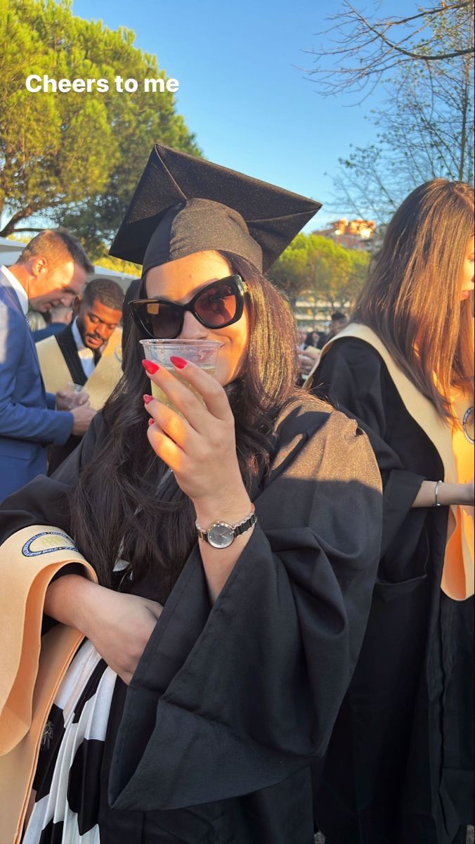 Brunette with graduation ceremony hat and robe holding a cup ofProsecco in golden hour Masters Degree Loading, 1st Class Honours Degree, First Class Honours Degree Aesthetic, Mba Degree Aesthetic, Master Degree Aesthetic, Masters Degree Aesthetic, First Class Honours Degree, Degree Aesthetic, Lawyer Bae