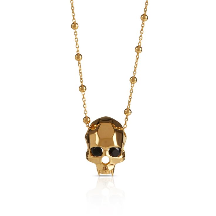 Geometric vampire skull pendant in 18 carat gold vermeil with black onyx eyes and fanged teeth. Kasun pieces are often playful, sometimes quirky, and always beautiful. Made in Thailand 18ct yellow gold plated sterling silver Gold Skull Jewelry For Party, Halloween Skull Shaped Gold Jewelry, Gold Skull Necklace For Halloween, Luxury Skull Jewelry For Gifts, Luxury Skull Shaped Jewelry For Gift, Yellow Gold Skull Jewelry For Gift, Fanged Teeth, Onyx Eyes, Vampire Skull