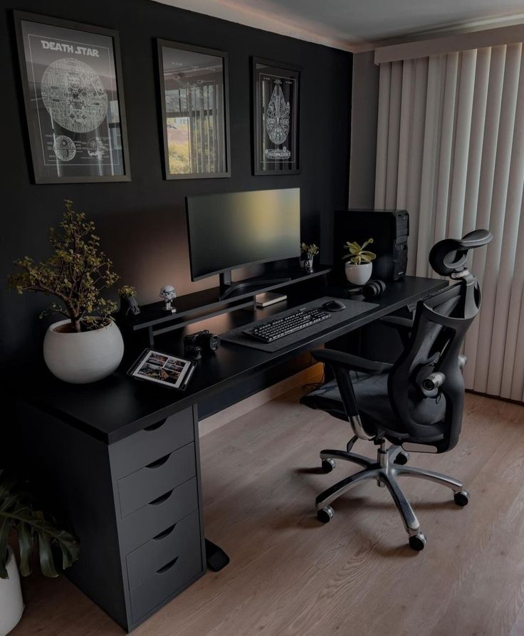 a black desk with a computer on it