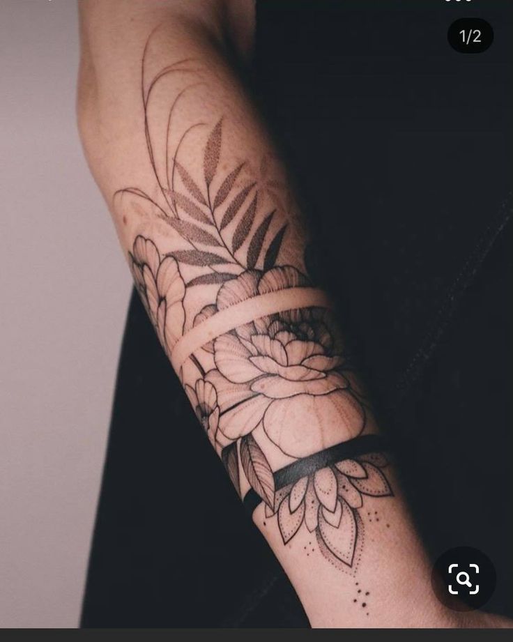 a person with a flower tattoo on their arm