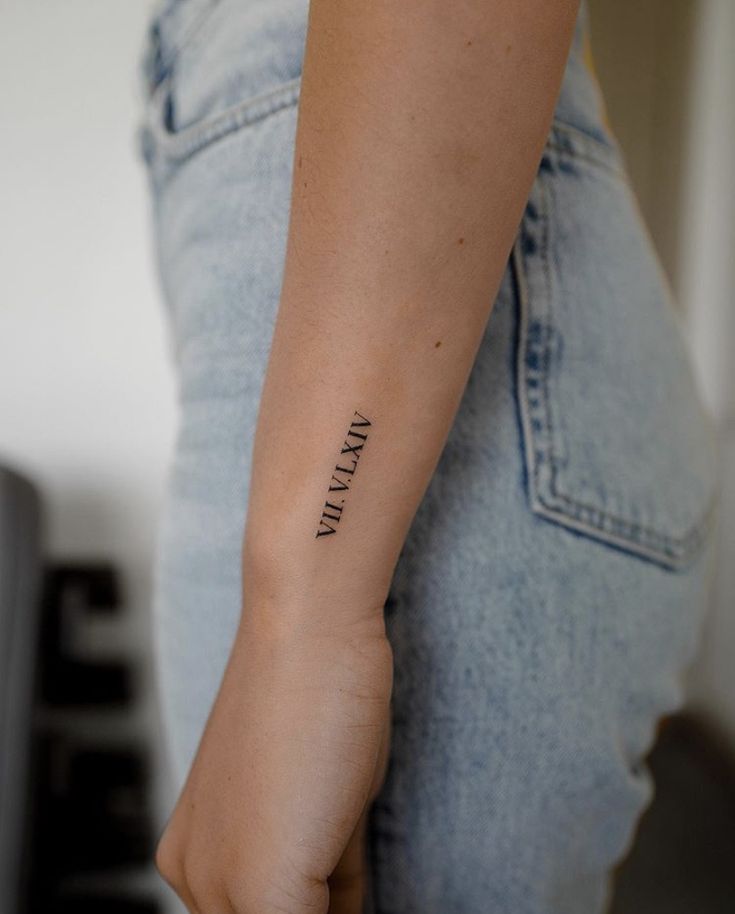 a woman's arm with a tattoo that reads, i am always in love