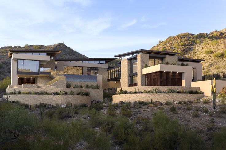 a large house sitting on top of a hill