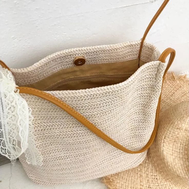 Carry Summer Wherever You Go Introducing our Bohemian Straw Woven Shoulder Bag, your new favorite summer accessory that combines effortless style with functional design. Perfect for beach getaways, sunny market days, or any casual outing, this handcrafted bag is as versatile as it is beautiful, ensuring you carry a piece of summer with you wherever you go. Key Features High-Quality Straw Material: Meticulously woven from the finest straw, this bag offers durability while staying lightweight, making it ideal for all-day wear. Compact Yet Spacious: With dimensions of 25*25*12 cm, it provides ample space for your essentials without being bulky. Secure Hasp Closure: Keeps your belongings safe with an easy-to-use hasp closure that adds an elegant touch to the bag's overall design. Benefits of O Spring Beach Sand-colored Straw Bag, Summer Style Sand-colored Shoulder Bag, Trendy Beige Straw Bag With Adjustable Strap, Beige Tote Shoulder Bag For Vacation, Trendy Beige Crochet Bag With Adjustable Strap, Chic Lightweight Beige Straw Bag, Bohemian Shoulder Bag For Spring Travel, Casual Beige Woven Bucket Bag, Bohemian Large Capacity Shoulder Bag For Spring