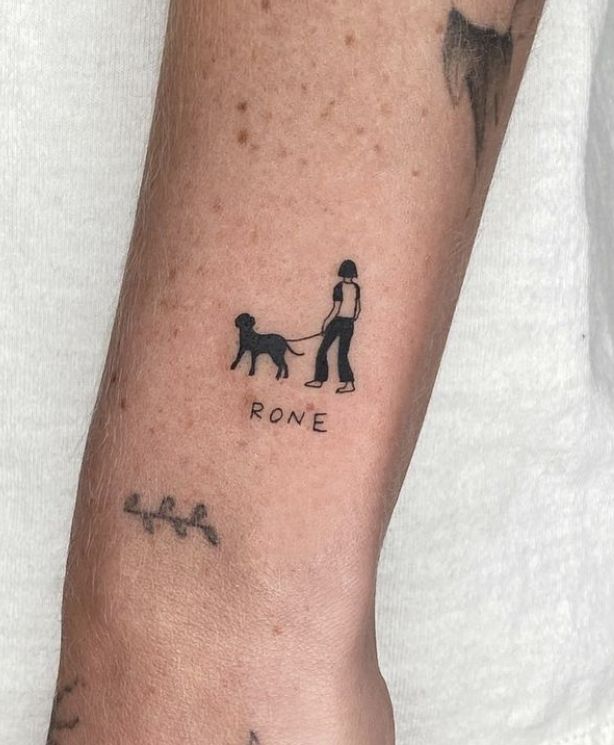 a person with a dog on their arm and the word rone written in black ink