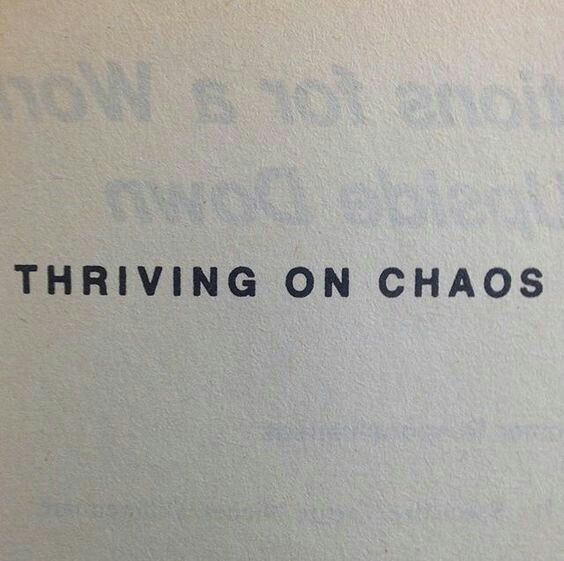 the word thriving on chaos written in black ink