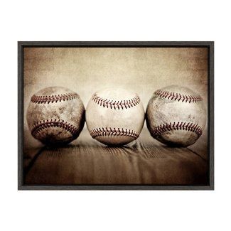 three baseballs sitting on top of a table