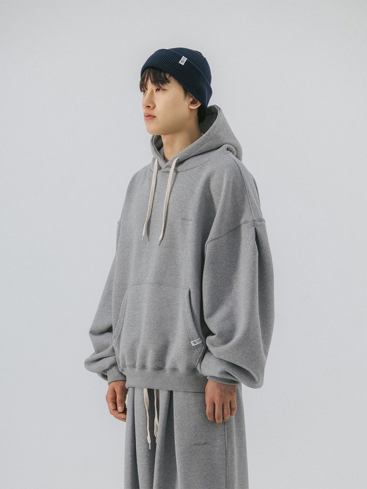 Editor's noteIt is a casual hoodie in oversized fit. Made of cotton and polyester blend fabric, the hoodie is durable and comfy. It is finished with tenter and tumble process to minimize shrinking and fabric twisting after wash. The hoodie has bias tape on the neck to prevent the neckline from stretching out. The silhouette of the hoodie is adjustable using the drawcord on the hem. - Hood with drawstring- Kangaroo pocket- Pintuck on sleeve for balloon silhouette- Ribbed cuffs, hem- Signatur Balloon Silhouette, Pretty Body, Sweat Hoodie, Bias Tape, Body Mods, Pin Tucks, Signature Logo, Casual Hoodie, Stretching