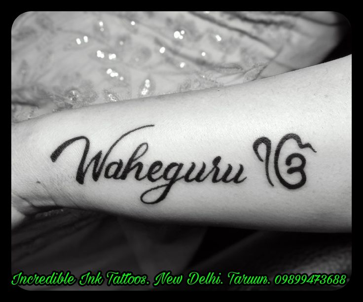 a woman with a tattoo on her arm that reads wakeguru 6 and has the words underneath it