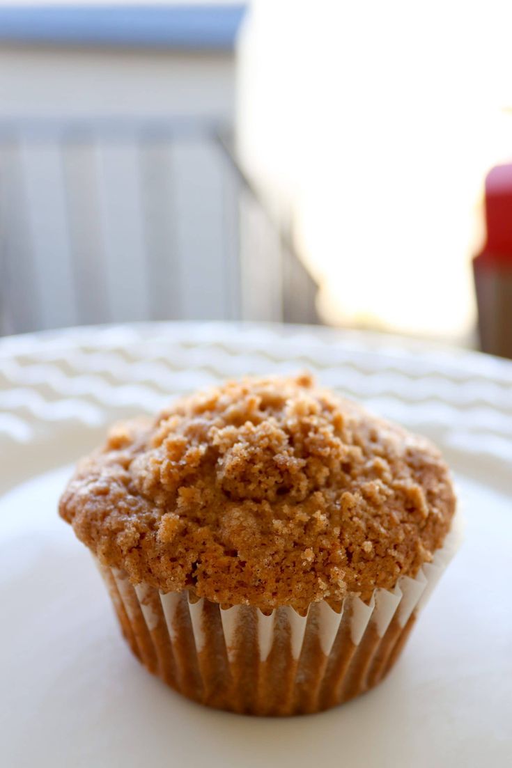 a muffin sitting on top of a white plate