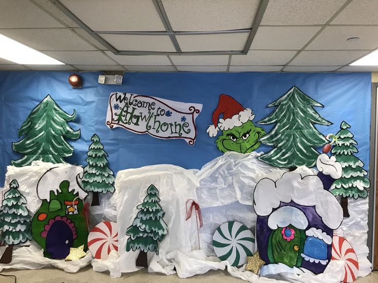 the grin's christmas decorations are on display in front of a blue wall with white snow