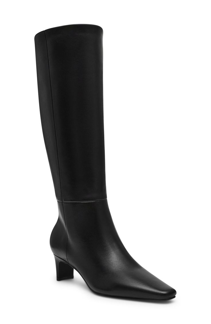 A slender square toe and blade heel balance a versatile boot shaped in a knee-high silhouette for timeless sophistication. 2" heel (size 8.5) 15" shaft; 16 1/4" calf circumference. Wide calf Pull-on style Leather upper/synthetic and textile lining/synthetic sole Imported Steve Madden Knee High Boots Leather, Elegant Tall Boots For Workwear, Elegant Tall Boots For Work, Elegant Tall Knee-high Boots For Workwear, Elegant Tall Heeled Boots For Workwear, Elegant Tall Heeled Boots For Work, Sleek High Shaft Boots For Workwear, Sleek Wide Calf Mid-calf Boots, Classic High Shaft Boots For Office