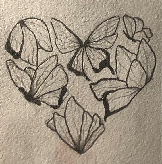 a drawing of butterflies in the shape of a heart on a white paper with black ink