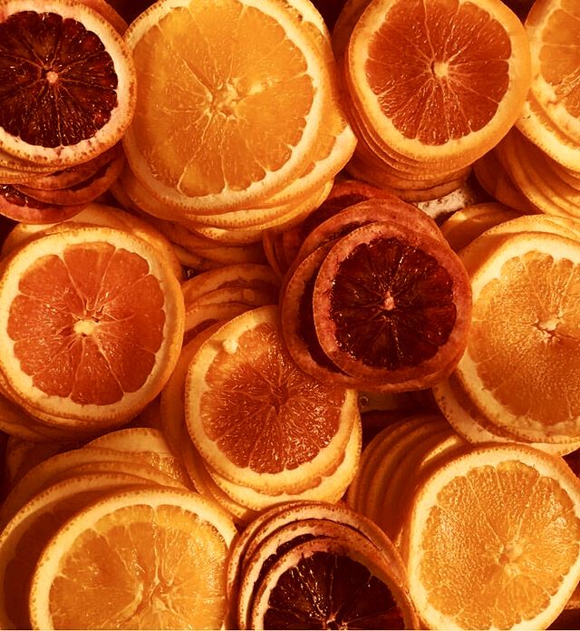 oranges cut in half sitting on top of each other