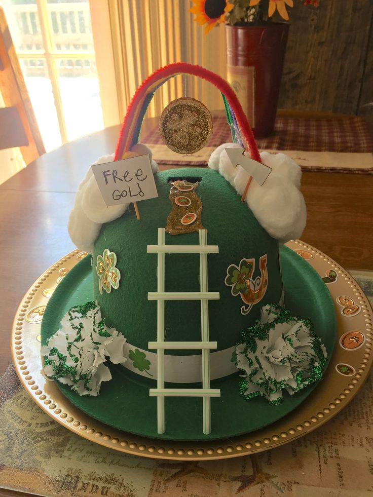 a cake that is sitting on top of a plate with flowers and decorations around it