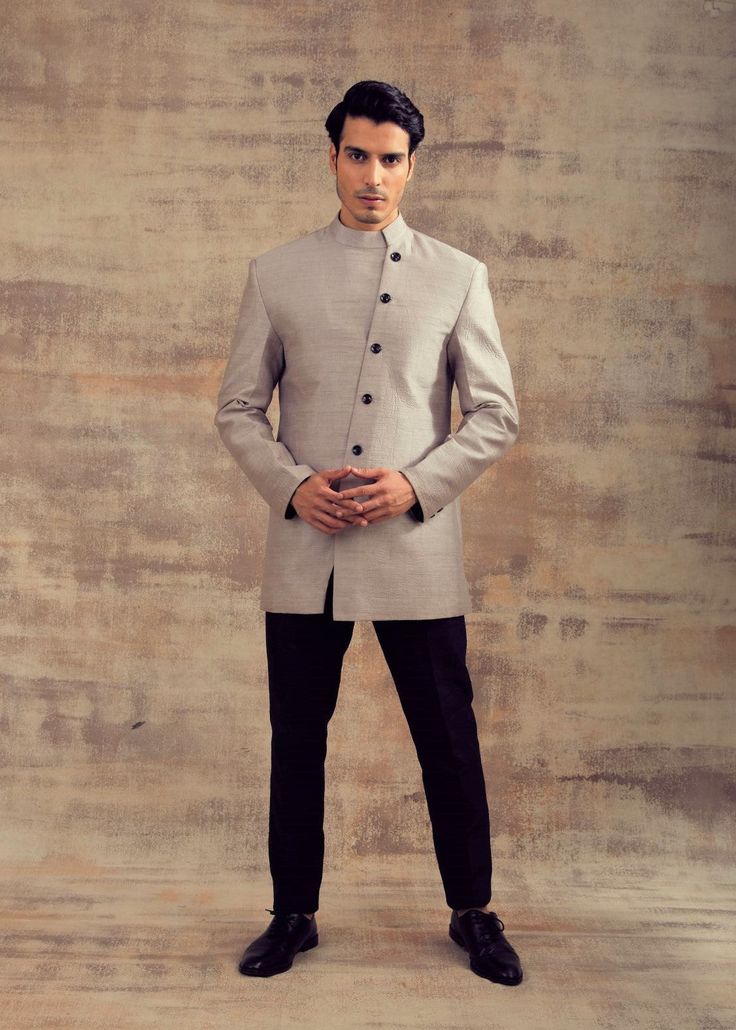 Grey Color Indo Western Jacket Tailored Bandhgala With Stand Collar For Formal Occasions, Tailored Formal Bandhgala With Stand Collar, Formal Tailored Bandhgala With Stand Collar, Tailored Bandhgala With Stand Collar For Semi-formal Occasions, Tailored Bandhgala For Semi-formal Occasions, Elegant Bandhgala With Stand Collar For Work, Elegant Wedding Outerwear In Suiting Fabric, Elegant Stand Collar Suit For Wedding, Elegant Tailored Suit With Stand Collar