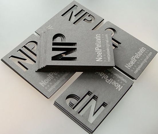 four business cards stacked on top of each other with the letter n in black and white