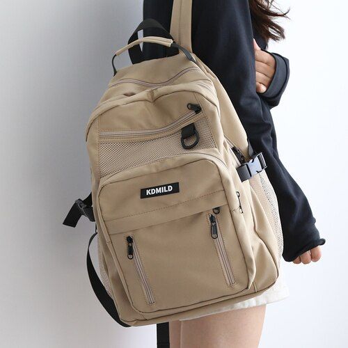 Introducing our Korean Front Pocket Backpack, the perfect companion for students who value style and functionality! This backpack combines a trendy Korean design with ample storage space, making it an ideal choice for school and beyond. Available in five beautiful colors - White, Black, Purple, Red, and Khaki - this backpack lets you express your personal style effortlessly. Whether you prefer a classic and clean look or a vibrant and eye-catching design, there's a color option to suit your tast Streetwear Backpack, Inktober List, Korean Backpack, Backpack Korean, Large Capacity Backpack, Korean Design, American Children, Stylish Backpacks, Street Trends