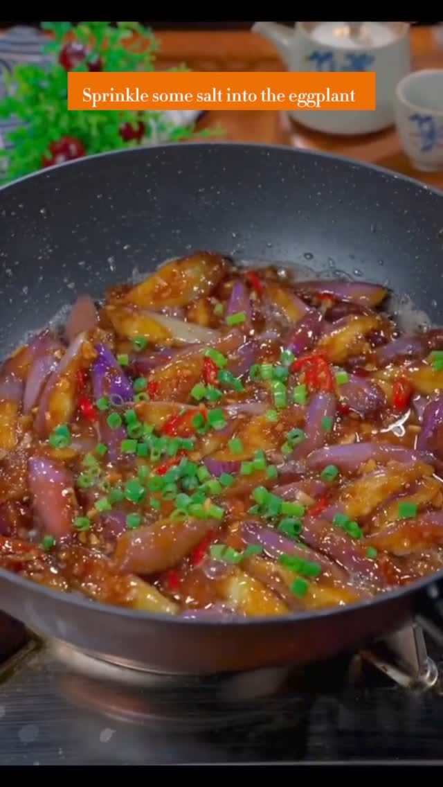 a pan filled with food sitting on top of a stove