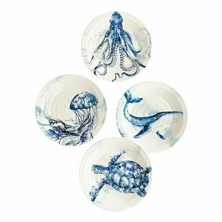 three blue and white plates with sea animals on them