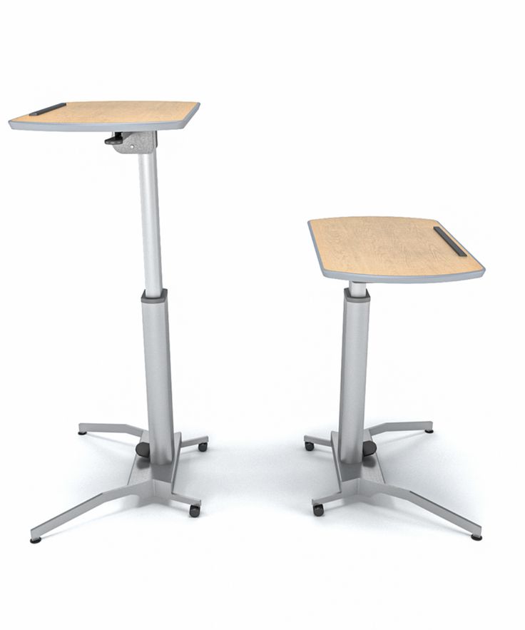 two metal and wood desks with one sitting on the other, both facing different directions