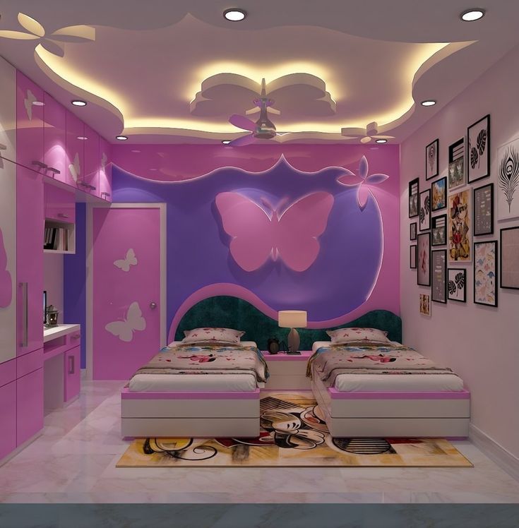 a bedroom with two beds and pink walls