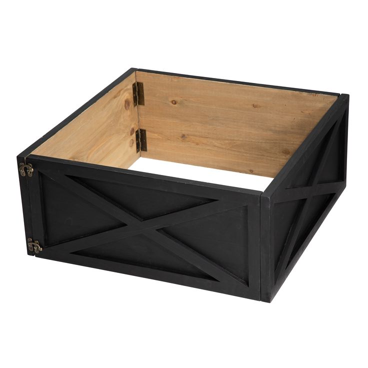 a wooden box with black paint and wood trimmings on the sides, sitting in front of a white background