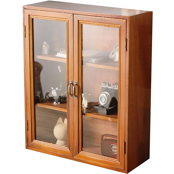 a wooden cabinet with two glass doors on the top and bottom, holding various items