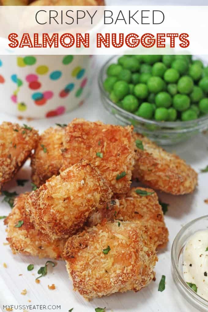 crispy baked salmon nuggets on a white plate with peas and ranch dressing