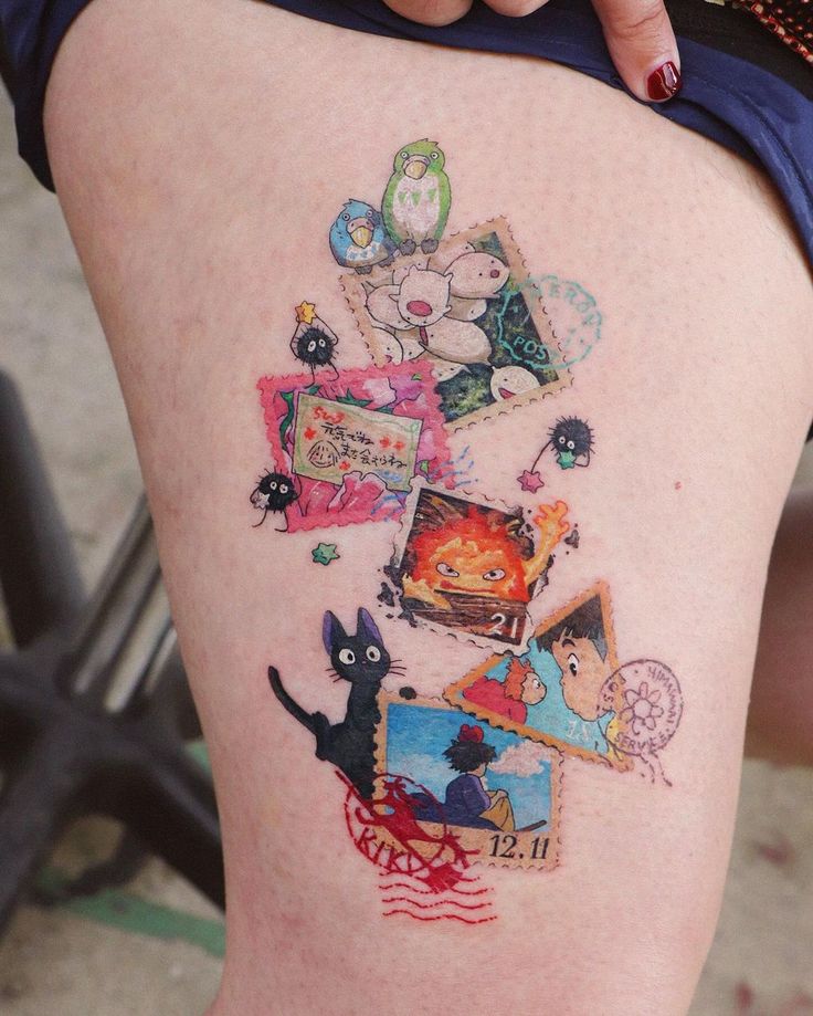 a woman's thigh with various pictures and animals on the back of her leg