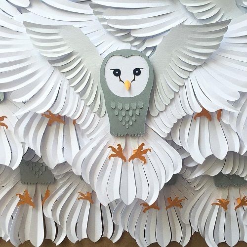 an owl made out of paper with wings