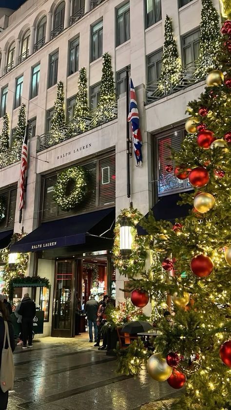 a christmas tree in front of a large building