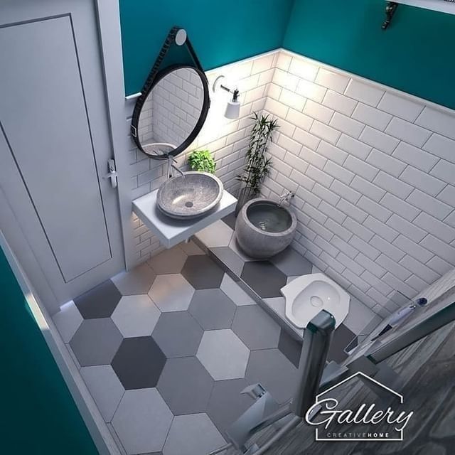 a bathroom with two sinks and a mirror in it's corner, next to a toilet