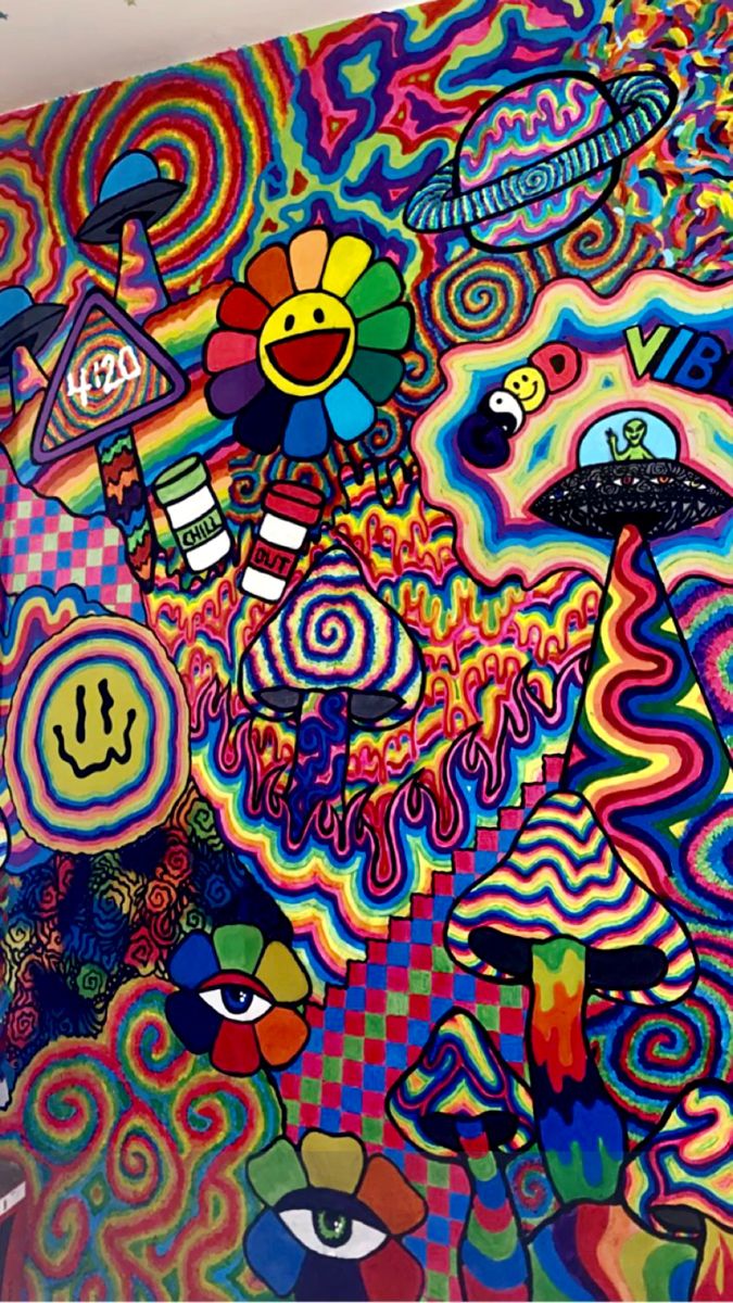 a large colorful painting on the side of a building with lots of different colors and shapes