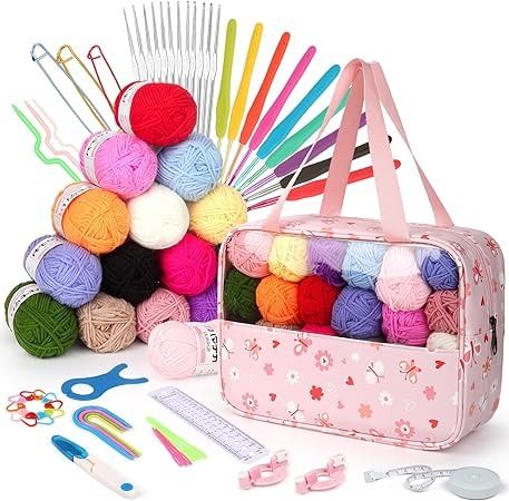 a pink bag filled with crochet and knitting supplies next to scissors, needles, yarn balls and other items