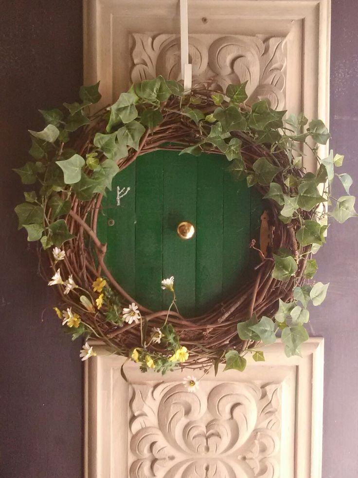 a green door with vines and flowers on it