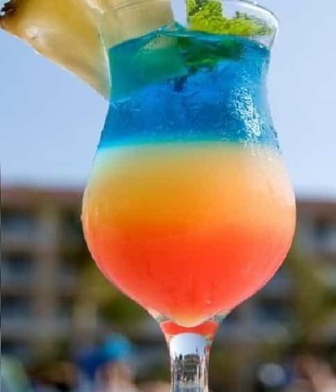 a colorful drink sitting on top of a table