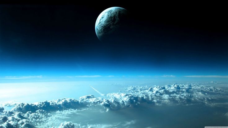 an image of the earth from space with clouds in foreground and bright blue sky above